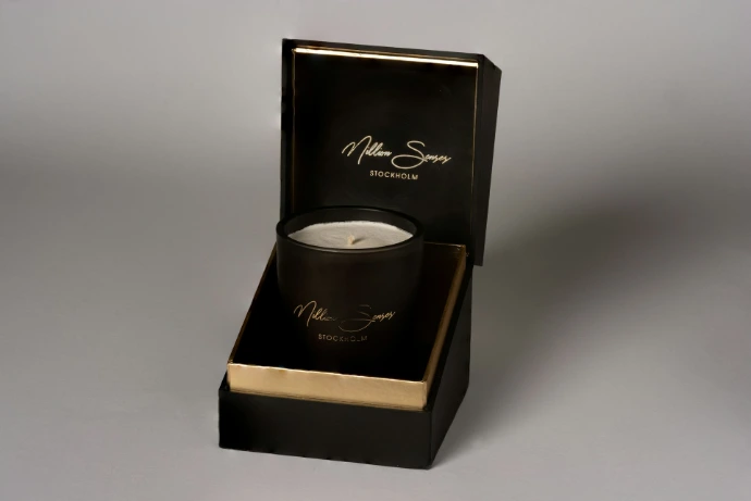 Black candle in a black gift box